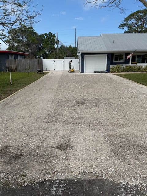 Gravel Driveway and Pathway Installation at a Beautiful Residence image
